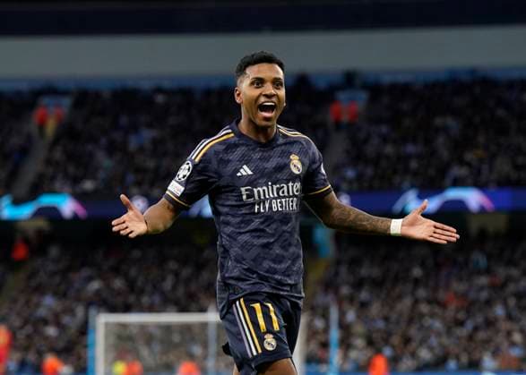 Manchester, England, 17th April 2024. Rodrygo of Real Madrid celebrates scoring the first goal of the night during the UEFA Champions League Quarter Final 2nd Leg match at the Etihad Stadium, Manchester. Picture credit should read: Andrew Yates Sportimage EDITORIAL USE ONLY. No use with unauthorised audio, video, data, fixture lists, club league logos or live services. Online in-match use limited to 120 images, no video emulation. No use in betting, games or single club league player publications. SPI-3082-0049