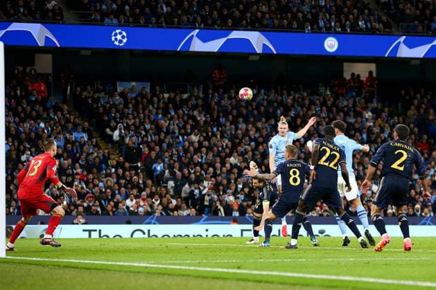 Erling Haaland of Manchester City has a header on goal Manchester City v Real Madrid, UEFA Champions League, Quarter Final, Second Leg, Football, Etihad Stadium, Manchester, UK - 17 Apr 2024 EDITORIAL USE ONLY No use with unauthorised audio, video, data, fixture lists, club league logos or live services. Online in-match use limited to 120 images, no video emulation. No use in betting, games or single club league player publications. Copyright: xMattxWest Shutterstockx 14434933ak