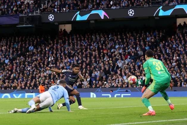 17th April 2024; Etihad Stadium, Manchester, England; Champions League Football, Quarter Final, Manchester City versus Real Madrid; Manchester City goalkeeper Ederson saves a shot from Rodrygo of Real Madrid who scores from the rebound  ActionPlus12631398 DavidxBlunsden