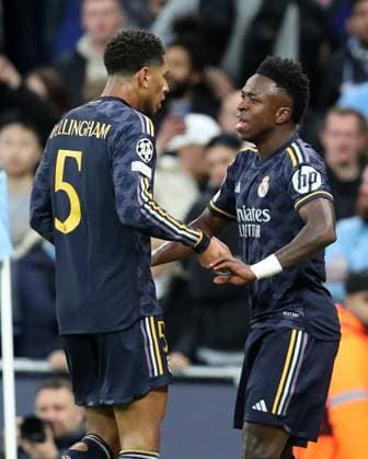 17th April 2024; Etihad Stadium, Manchester, England; Champions League Football, Quarter Final, Manchester City versus Real Madrid; Rodrygo of Real Madrid celebrates with team mate Jude Bellingham after scoring the opening goal after 12 minutes  ActionPlus12631405 DavidxBlunsden