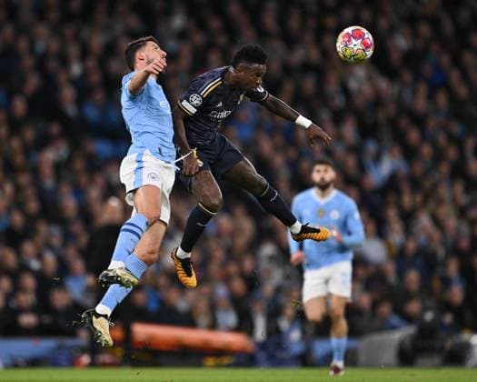 Vinicius Junior of Real Madrid and Ruben Dias of Manchester City challenge for the ball in the air during the UEFA Champions League semi final return leg football match between Manchester City and Real Madrid at the Etihad Stadium in Manchester England (Will Palmer SPP) Copyright: xWillxPalmer SPPx spp-en-WiPa-WP9_8036