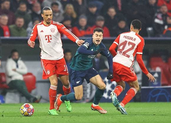 Gabriel Martinelli of Arsenal fouled by Leroy Sane of Bayern Munich Bayern Munich v Arsenal, UEFA Champions League, Quarter Final, Second Leg, Football, Allianz Arena, Munich, Germany - 17 Apr 2024 EDITORIAL USE ONLY No use with unauthorised audio, video, data, fixture lists, club league logos or live services. Online in-match use limited to 120 images, no video emulation. No use in betting, games or single club league player publications. Copyright: xMichaelxZemanek Shutterstockx 14434936p