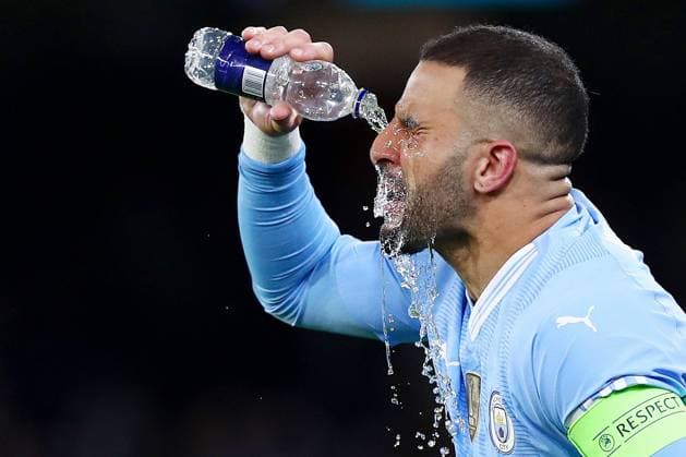 Kyle Walker of Manchester City drinks Manchester City v Real Madrid, UEFA Champions League, Quarter Final, Second Leg, Football, Etihad Stadium, Manchester, UK - 17 Apr 2024 EDITORIAL USE ONLY No use with unauthorised audio, video, data, fixture lists, club league logos or live services. Online in-match use limited to 120 images, no video emulation. No use in betting, games or single club league player publications. Copyright: xMattxWest Shutterstockx 14434933at