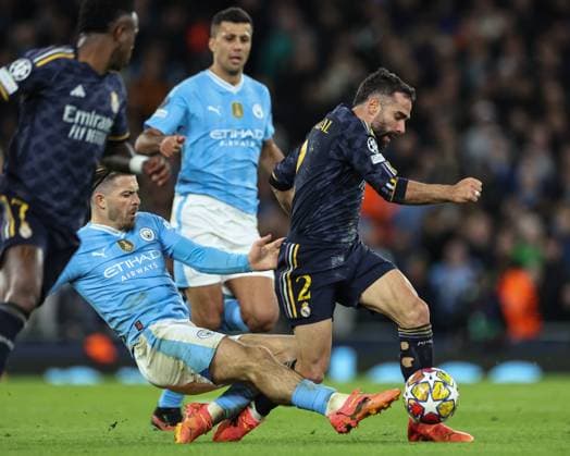 UEFA Champions League Quarter Final Manchester City v Real Madrid Jack Grealish of Manchester City fouls Daniel Carvajal of Real Madrid during the UEFA Champions League Quarter Final Manchester City vs Real Madrid at Etihad Stadium, Manchester, United Kingdom, 17th April 2024 (Photo by Mark Cosgrove News Images) Manchester Etihad Stadium Manchester United, ManU Kingdom Copyright: xMarkxCosgrove NewsxImagesx