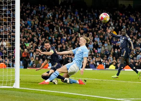 Manchester, England, 17th April 2024. Nacho Fernandez of Real Madrid clears off the line as Erling Haaland of Manchester City closes in during the UEFA Champions League Quarter Final 2nd Leg match at the Etihad Stadium, Manchester. Picture credit should read: Andrew Yates Sportimage EDITORIAL USE ONLY. No use with unauthorised audio, video, data, fixture lists, club league logos or live services. Online in-match use limited to 120 images, no video emulation. No use in betting, games or single club league player publications. SPI-3082-0075
