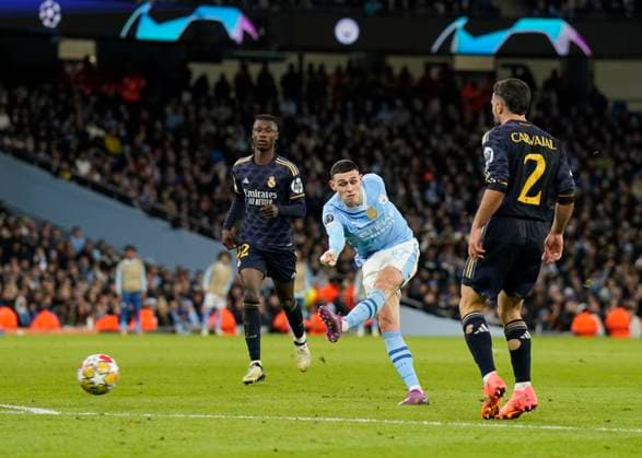 Manchester, England, 17th April 2024. Phil Foden of Manchester City takes a shot during the UEFA Champions League Quarter Final 2nd Leg match at the Etihad Stadium, Manchester. Picture credit should read: Andrew Yates Sportimage EDITORIAL USE ONLY. No use with unauthorised audio, video, data, fixture lists, club league logos or live services. Online in-match use limited to 120 images, no video emulation. No use in betting, games or single club league player publications. SPI-3082-0074