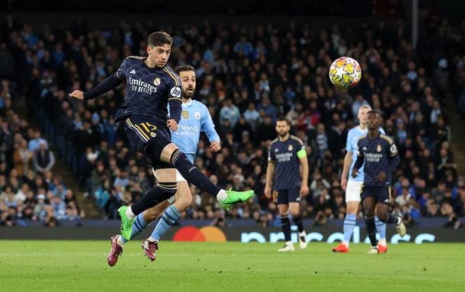 17th April 2024; Etihad Stadium, Manchester, England; Champions League Football, Quarter Final, Manchester City versus Real Madrid; Federico Valverde of Real Madrid volleys a shot at goal  ActionPlus12631425 DavidxBlunsden