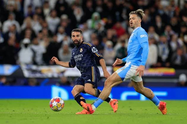 Manchester City v Real Madrid Champions League 17 04 2024. Quarter Final Daniel Carvajal (2) of Real Madrid passes the ball watched by Jack Grealish (10) of Manchester City during the Champions League quarter-final second leg match between Manchester City and Real Madrid at the Etihad Stadium, Manchester, England on 17 April 2024. Manchester Etihad Stadium Manchester England Editorial use only , Copyright: xConorxMolloyx PSI-19472-0068
