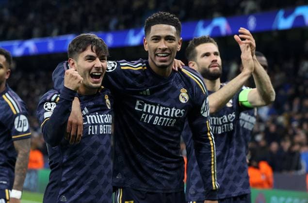 17th April 2024; Etihad Stadium, Manchester, England; Champions League Football, Quarter Final, Manchester City versus Real Madrid; Brahim Diaz and Jude Bellingham of Real Madrid celebrate in front of the visiting fans  ActionPlus12631558 DavidxBlunsden