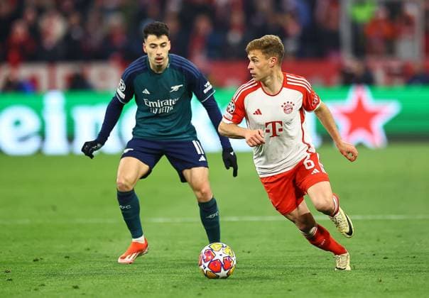 Joshua Kimmich of Bayern Munich and Gabriel Martinelli of Arsenal Bayern Munich v Arsenal, UEFA Champions League, Quarter Final, Second Leg, Football, Allianz Arena, Munich, Germany - 17 Apr 2024 EDITORIAL USE ONLY No use with unauthorised audio, video, data, fixture lists, club league logos or live services. Online in-match use limited to 120 images, no video emulation. No use in betting, games or single club league player publications. Copyright: xMichaelxZemanek Shutterstockx 14434936bo