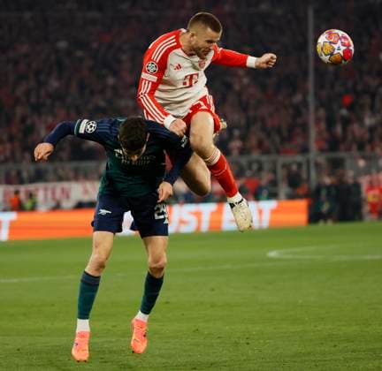 (240418) -- MUNICH, April 18, 2024 -- Eric Dier (top) of Bayern Munich vies with Kai Havertz of Arsenal during the UEFA Champions League quarterfinal 2nd Leg football match between Bayern Munich and Arsenal in Munich, Germany, April 17, 2024. (Photo by Xinhua) (SP)GERMANY-MUNICH-FOOTBALL-UEFA CHAMPIONS LEAGUE-BAYERN MUNICH VS ARSENAL PhilippexRuiz 