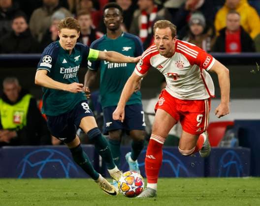 (240418) -- MUNICH, April 18, 2024 -- Harry Kane (R) of Bayern Munich vies with Martin Odegaard (L) of Arsenal during the UEFA Champions League quarterfinal 2nd Leg football match between Bayern Munich and Arsenal in Munich, Germany, April 17, 2024. (Photo by Xinhua) (SP)GERMANY-MUNICH-FOOTBALL-UEFA CHAMPIONS LEAGUE-BAYERN MUNICH VS ARSENAL PhilippexRuiz 
