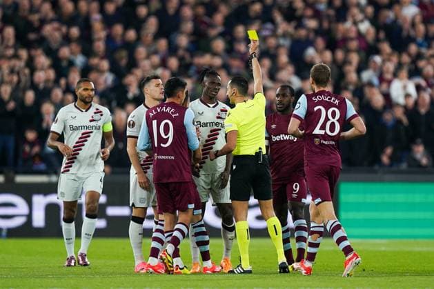 West Ham United FC v Bayer 04 Leverkusen Odilon Kossounou of Bayer Leverkusen being shown a yellow card during the West Ham United FC v Bayer 04 Leverkusen UEFA Europa League Quater-Finals 2nd Leg match at London Stadium, London, England, United Kingdom on 18 April 2024 Editorial use only. All images are copyright Every Second Media Limited. No images may be reproduced without prior permission. Copyright: xIMAGO EveryxSecondxMediax ESM-0986-0010