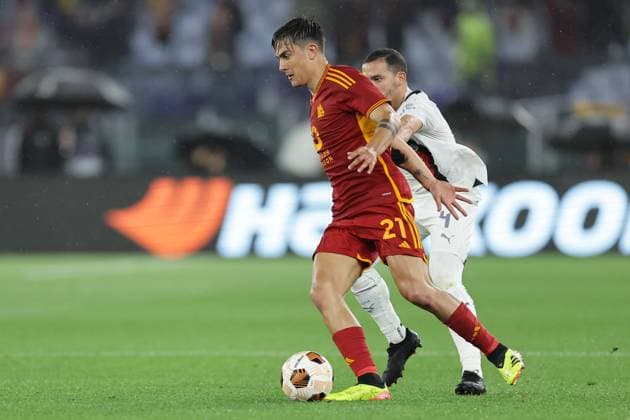 UEFA Europa League AS Roma and AC Milan Roma™s Argentinian forward Paulo Dybala challenges for the ball with Milan s Algerian midfielder Ismael Bennacer during the Quarter-Final second leg match between AS Roma and AC Milan at Stadio Olimpico on April 18, 2024 in Rome, Italy. ABPH2171 Copyright: xAntonioxBalascox