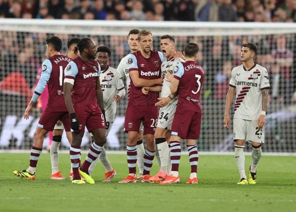 London, England, 18th April 2024. Tomas Soucek of West Ham United attempts to calm down Granit Xhaka of Bayer Leverkusen during the UEFA Europa League match at the London Stadium, London. Picture credit should read: David Klein Sportimage EDITORIAL USE ONLY. No use with unauthorised audio, video, data, fixture lists, club league logos or live services. Online in-match use limited to 120 images, no video emulation. No use in betting, games or single club league player publications. SPI-3091-0032