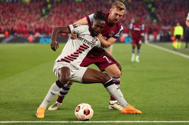 18th April 2024; London Stadium, London, England; Europa League Football, Quarter Final, Second Leg, West Ham United versus Bayer Leverkusen; Odilon Kossounou of Bayer Leverkusen is under pressure from James Ward-Prowse of West Ham United  ActionPlus12631855 ShaunxBrooks