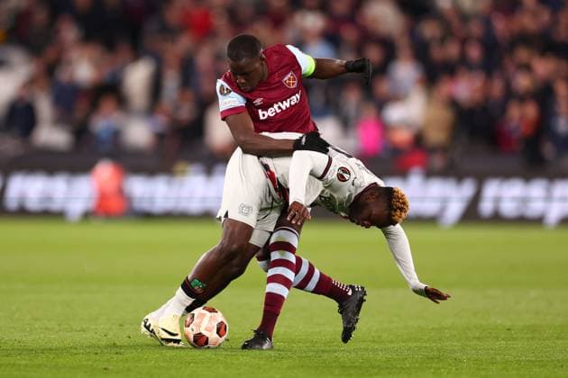 18th April 2024; London Stadium, London, England; Europa League Football, Quarter Final, Second Leg, West Ham United versus Bayer Leverkusen; Kurt Zouma of West Ham United fouls Victor Boniface of Bayer Leverkusen  ActionPlus12631859 ShaunxBrooks