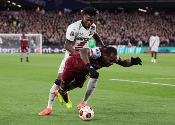 London, England, 18th April 2024. Edmond Tapsoba of Bayer Leverkusen tussles with Michail Antonio of West Ham United during the UEFA Europa League match at the London Stadium, London. Picture credit should read: David Klein Sportimage EDITORIAL USE ONLY. No use with unauthorised audio, video, data, fixture lists, club league logos or live services. Online in-match use limited to 120 images, no video emulation. No use in betting, games or single club league player publications. SPI-3091-0037