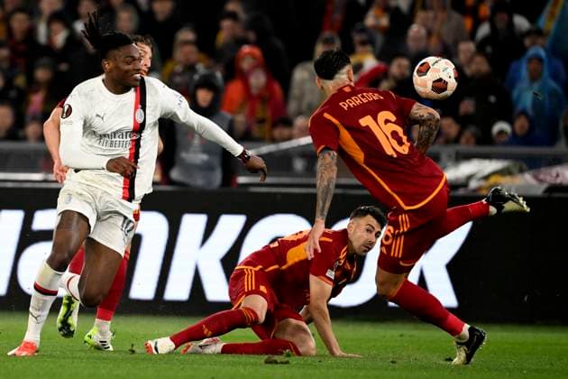 Edoardo Bove, Rafael Leao of AC Milan, Leandro Paredes and Stephan El Shaarawy of AS Roma compete for the ball during the Europa League football match between AS Roma and AC Milan at Olimpico stadium in Rome (Italy), April 18th, 2024. AndreaxStaccioli