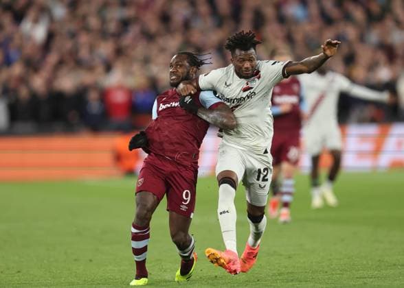 London, England, 18th April 2024. Michail Antonio of West Ham United tussles with Edmond Tapsoba of Bayer Leverkusen during the UEFA Europa League match at the London Stadium, London. Picture credit should read: David Klein Sportimage EDITORIAL USE ONLY. No use with unauthorised audio, video, data, fixture lists, club league logos or live services. Online in-match use limited to 120 images, no video emulation. No use in betting, games or single club league player publications. SPI-3091-0040