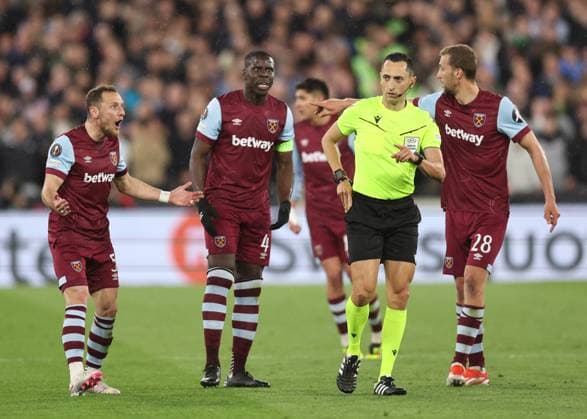 London, England, 18th April 2024. Kurt Zouma of West Ham United glares at the referee following his yellow card during the UEFA Europa League match at the London Stadium, London. Picture credit should read: David Klein Sportimage EDITORIAL USE ONLY. No use with unauthorised audio, video, data, fixture lists, club league logos or live services. Online in-match use limited to 120 images, no video emulation. No use in betting, games or single club league player publications. SPI-3091-0045