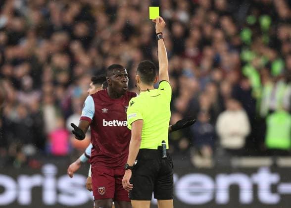 London, England, 18th April 2024. Kurt Zouma of West Ham United shown the yellow card during the UEFA Europa League match at the London Stadium, London. Picture credit should read: David Klein Sportimage EDITORIAL USE ONLY. No use with unauthorised audio, video, data, fixture lists, club league logos or live services. Online in-match use limited to 120 images, no video emulation. No use in betting, games or single club league player publications. SPI-3091-0046