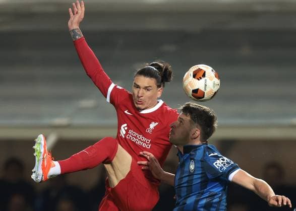 Bergamo, Italy, 18th April 2024. Darwin Nunez of Liverpool FC challenges for an aerial ball with Berat Djimsiti of Atalanta during the UEFA Europa League match at Stadio di Bergamo , Bergamo. Picture credit should read: Jonathan Moscrop Sportimage EDITORIAL USE ONLY. No use with unauthorised audio, video, data, fixture lists, club league logos or live services. Online in-match use limited to 120 images, no video emulation. No use in betting, games or single club league player publications. SPI-3084-0070