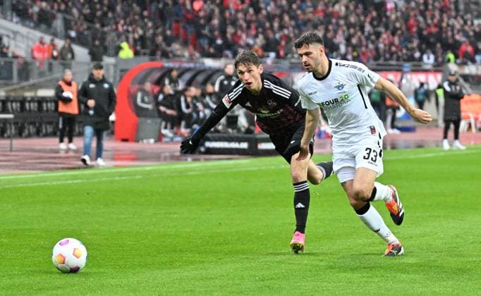 19 04 2024 Soccer Season 2023 2024 2 Soccer Bundesliga 30 Matchday 1 FC Nürnberg FCN Club SC Paderborn 07 SCP Sportfoto Zink xwoxzix DFL regulations prohibit any use of photographs as image sequences and or quasi video only for editorial use Benjamin Goller 14, 1 FC Nürnberg FCN Marcel Hoffmeier 33, SC Paderborn