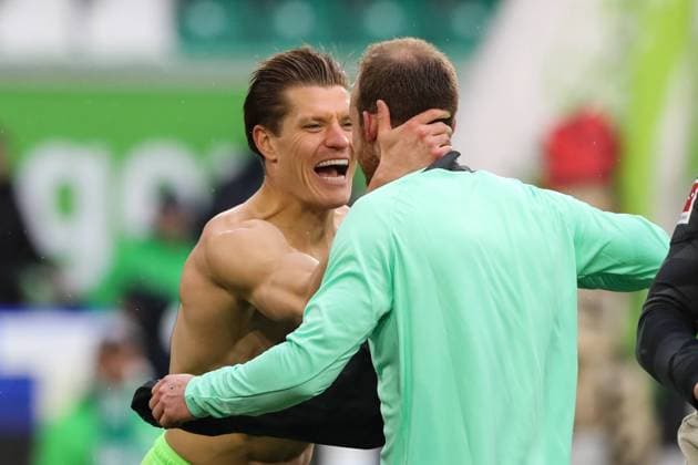 Kevin Behrens VfL Wolfsburg,17 with Maximilian Arnold VfL Wolfsburg,27 1 Soccer Bundesliga Season 2023 2024 Point Match VfL Wolfsburg vs VfL Bochum at the Volkswagen Arena in Wolfsburg Action,Soccer,Germany,Man,Men,20 04 2024