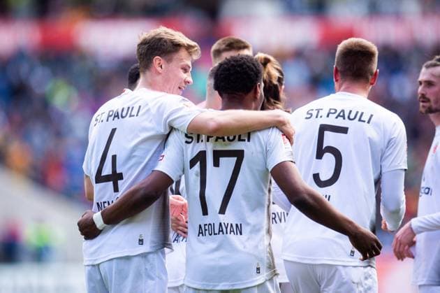 21 04 2024 Soccer, 2023 2024, 1 Bundesliga, Matchday 30, Hannover 96 FC St Pauli M Oladapo Afolayan Pauli celebrates after his goal to 0 1 with David Nemeth Pauli DFL REGULATIONS PROHIBIT ANY USE OF PHOTOGRAPHS AS IMAGE SEQUENCES AND OR QUASI VIDEO