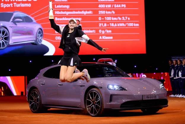 21 04 2024, Germany, Stuttgart, Porsche Tennis Grand Prix 2024, Final, Elena Rybakina KAZ jumps into the air with the trophy in front of her winning car Taycab 4S Sport Turismo