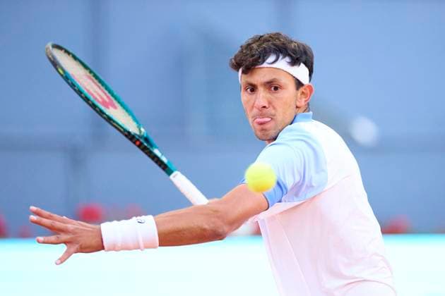 Mutua Madrid Open - Day One Emilio Nava of USA returns a shot against Benjamin Hassan of Germany during day one of the Mutua Madrid Open 2024 at Caja Magica on April 22, 2024, in Madrid, Spain. Madrid Caja Magica Madrid Spain RL_MMO24_264 Copyright: xRicardoxLarreinax