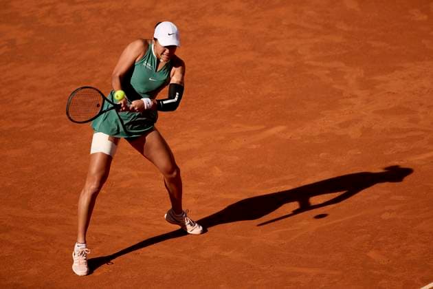 Xiyu Wang of China returns a shot against Ana Bogdan of Romania during day two of the Mutua Madrid Open 2024 at Caja Magica on April 23, 2024, in Madrid, Spain.  (251065147)
