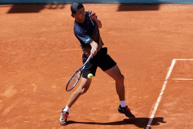 MADRID, SPAIN - APRIL 24: Taro Daniel of Japon returns the ball during their match against Aleksandar Vukic on Day 3 of the Mutua Madrid Open at Caja Magica Stadium in Madrid. ONLYxEDITORIALxUSAGE  (251128015)