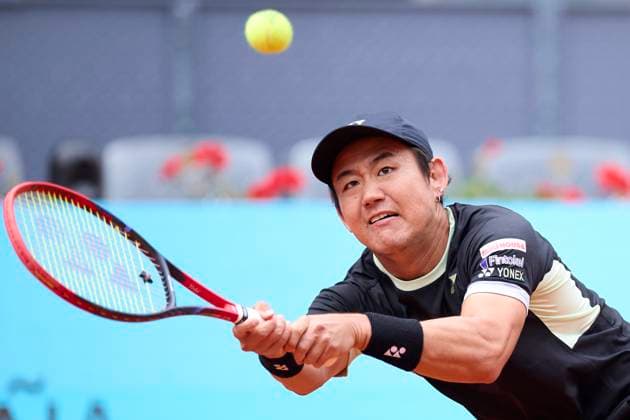 Yoshihito Nishioka of Japan returns a shot against Felix Auger-Aliassime of Canada during day four of the Mutua Madrid Open 2024 at Caja Magica on April 25, 2024, in Madrid, Spain.  (251250628)