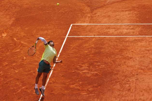 MADRID, SPAIN - APRIL 26:Carlos Alcaraz returns the ball against Alexander Shevchenko during their match on Day 5 of the Mutua Madrid Open at Caja Magica Stadium in Madrid. ONLYxEDITORIALxUSAGE (251341820)