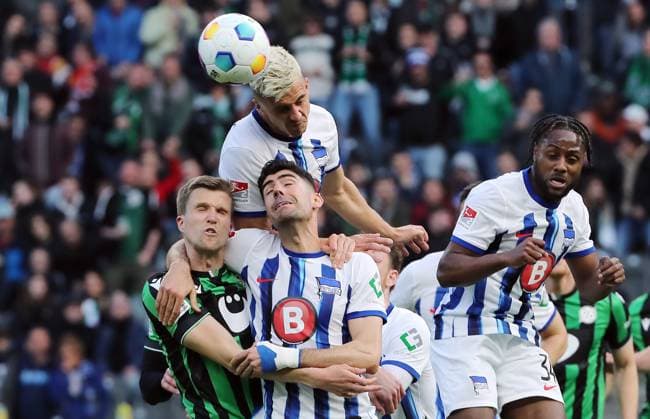 Fabian Kunze, Andreas Bouchalakis, Marc Oliver Kempf, Deyovaisio Zeefuik duel match scene Action Sport Soccer Football DFL 2 Bundesliga Men 31 Matchday Season 2023 2024 26 04 2024 Hertha BSC Berlin vs Hannover 96 DFL regulations prohibit any use of photographs as image sequences and or quasi video
