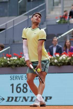 MADRID, SPAIN - APRIL 26:Carlos Alcaraz returns the ball against Alexander Shevchenko during their match on Day 5 of the Mutua Madrid Open at Caja Magica Stadium in Madrid. ONLYxEDITORIALxUSAGE  (251341976)
