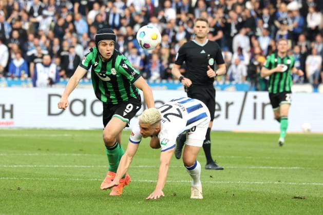 DEU, DFL, 2 FBL, Hertha BSC vs Hannover 96, 26 04 2024, Berliner Olympiastadion, Berlin, DEU, DFL, 2 FBL, Hertha BSC vs Hannover 96, in the picture Marc Oliver Kempf Hertha BSC Berlin 20 , Nicolo Tresoldi Hannover 96 9 DFL regulations prohibit any use of Photographs as image sequences and or quasi video Foto Juergen Engler nordphoto GmbH nordphotoxGmbHx xEngler nph00076