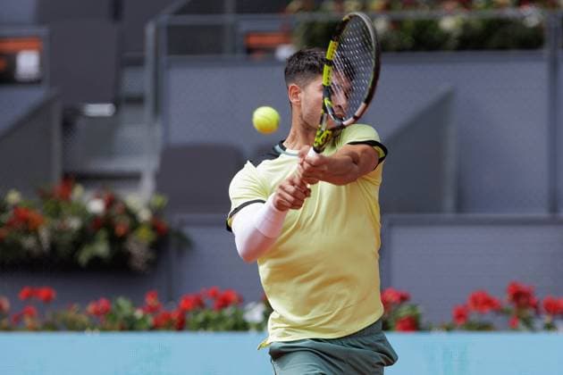 April 26, 2024, Madrid, Spain: Carlos Alcaraz plays against Alexander Shevchenko (not pictured) during their match on Day 5 of the Mutua Madrid Open at Caja Magica Stadium. Carlos Alcaraz won 6-2 , 6-1 Madrid Spain - ZUMAs197 20240426_aaa_s197_085 Copyright: xGuillermoxMartinezx