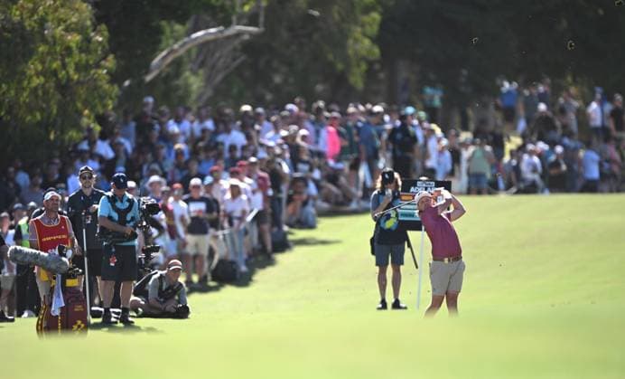 LIV GOLF ADELAIDE, Cameron Smith plays from the fairway in front of a large gallery during the final round of LIV Golf Adelaide at the Grange Golf Club in Adelaide, Sunday, April 28, 2024. ( NO ARCHIVING, EDITORIAL USE ONLY, NO USE IN BOOKS WITHOUT CONSENT ADELAIDE SOUTH AUSTRALIA AUSTRALIA  Copyright: xMICHAELxERREYx 20240428138173212516