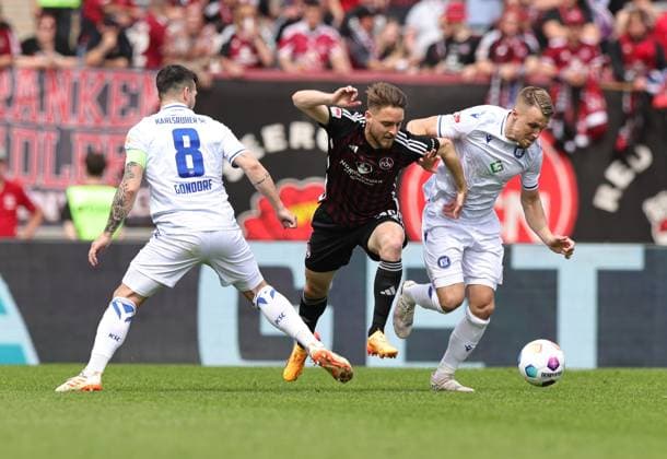 28 04 2024 Soccer Season 2023 2024 2 Soccer Bundesliga 31 Matchday 1 FC Nürnberg FCN Club Karlsruher SC KSC Sportfoto Zink DaMa xdaxmax DFL regulations prohibit any use of photographs as image sequences and or quasi video only for editorial use Jerome Gondorf 8, Karlsruher SC KSC Lukas Schleimer 36, 1 FC Nürnberg FCN Marco Thiede 21, Karlsruher SC KSC
