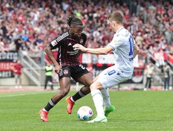 28 04 2024 Soccer Season 2023 2024 2 Soccer Bundesliga 31 Matchday 1 FC Nürnberg FCN Club Karlsruher SC KSC Sportfoto Zink DaMa xdaxmax DFL regulations prohibit any use of photographs as image sequences and or quasi video only for editorial use Joseph Hungbo 23, 1 FC Nürnberg FCN Marvin Wanitzek 10, Karlsruher SC KSC