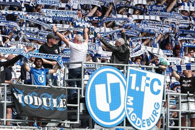 Goalkeeper Uli Schulze, Axel Tyll, Wolfgang Seguin 1 FC Magdeburg stand in the fan block before the match 2 Soccer Bundesliga Season 2023 2024 1 FC Magdeburg vs VfL Osnabrück at the MDCC Arena in Magdeburg Soccer,Man,Men,Germany,28 04 2024