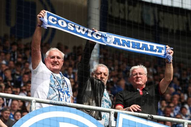 Goalkeeper Uli Schulze, Axel Tyll, Wolfgang Seguin 1 FC Magdeburg stand in the fan block before the match 2 Soccer Bundesliga Season 2023 2024 1 FC Magdeburg vs VfL Osnabrück at the MDCC Arena in Magdeburg Soccer,Man,Men,Germany,28 04 2024