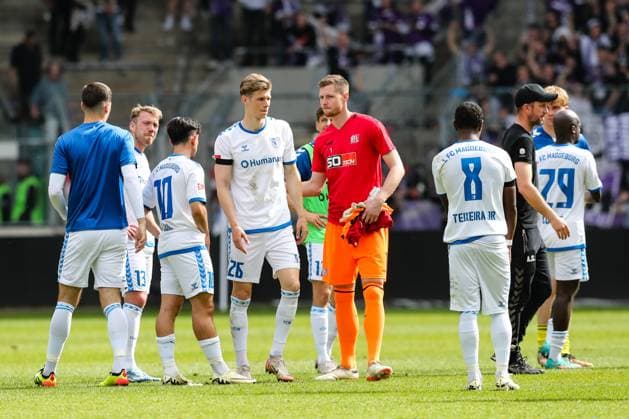 Luca Schuler 1 FC Magdeburg,26 and goalkeeper Lennart Grill VfL Osnabrück,1 2 Soccer Bundesliga Season 2023 2024 1 FC Magdeburg vs VfL Osnabrück at the MDCC Arena in Magdeburg Action,Soccer,Man,Men,Germany,28 04 2024