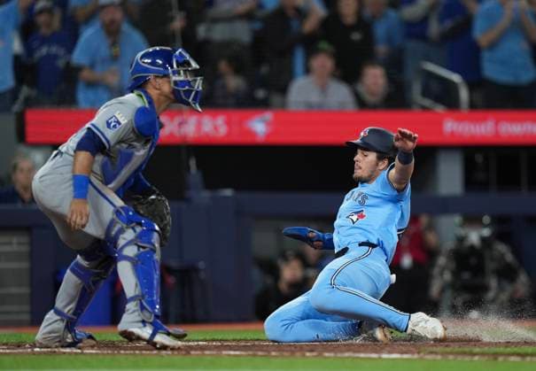April 29, 2024, Toronto, On, CANADA: Toronto Blue Jays third baseman Addison Barger (47) slides past Kansas City Royals catcher Freddy Fermin (34) to score a run during sixth inning American League MLB, Baseball Herren, USA baseball action in Toronto on Monday, April 29, 2024. Canada News - April 29, 2024  - ZUMAc35_ 20240429_zaf_c35_132 Copyright: xNathanxDenettex