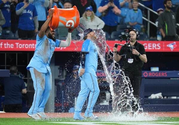 April 29, 2024, Toronto, On, CANADA: Toronto Blue Jays first baseman Vladimir Guerrero Jr. (27) dumps water on Toronto Blue Jays designated Hitter Justin Turner (2) after defeating the Kansas City Royals during ninth inning American League MLB, Baseball Herren, USA baseball action in Toronto on Monday, April 29, 2024. Canada News - April 29, 2024  - ZUMAc35_ 20240429_zaf_c35_137 Copyright: xNathanxDenettex