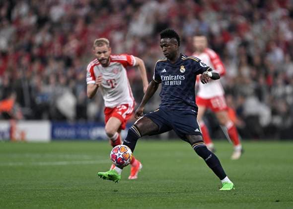 30 04 2024, Football UEFA Championsleague 2023 2024 Semifinal, FC Bayern Munich Real Madrid, at Allianz Arena Munich L R Konrad Laimer Bayern Munich vs Vinicius Junior Real Madrid DFL and DFB regulations prohibit any use of photographs as image sequences and or quasi video