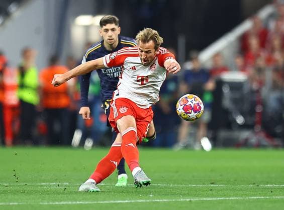 Harry Kane of Bayern Munich has a shot Bayern Munich v Real Madrid, UEFA Champions League, Semi Final, First Leg, Football, Allianz Arena, Munich, Germany - 30 Apr 2024 EDITORIAL USE ONLY No use with unauthorised audio, video, data, fixture lists, club league logos or live services. Online in-match use limited to 120 images, no video emulation. No use in betting, games or single club league player publications. Copyright: xMichaelxZemanek Shutterstockx 14454338o